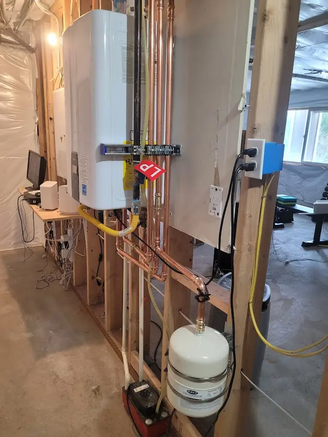 Licensed plumber repairing a kitchen sink in Pleasant Run